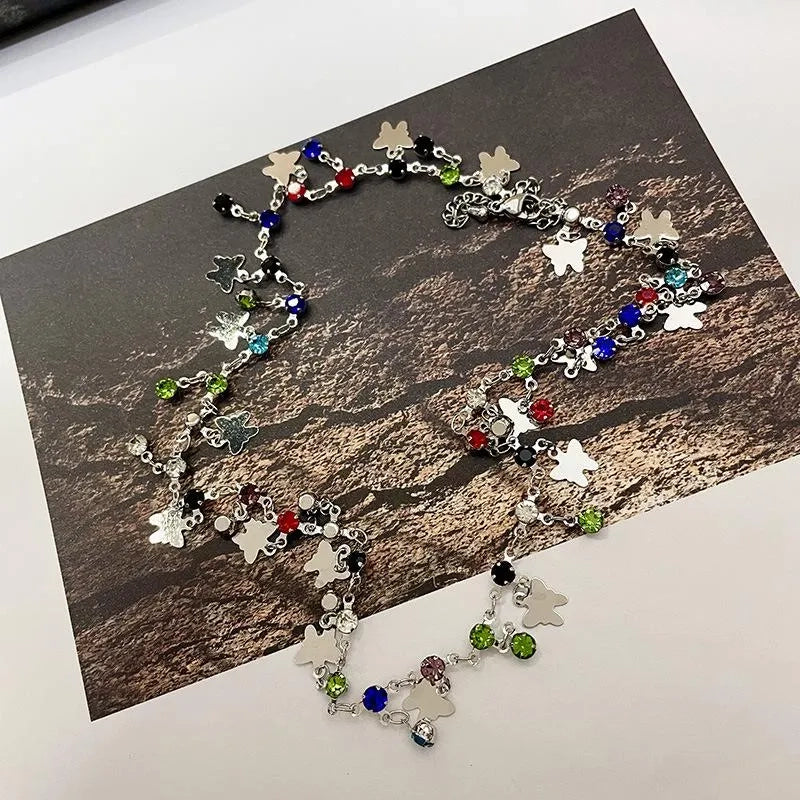 Collana a farfalla e stella realizzata a mano con perline: ciondolo con zirconi colorati