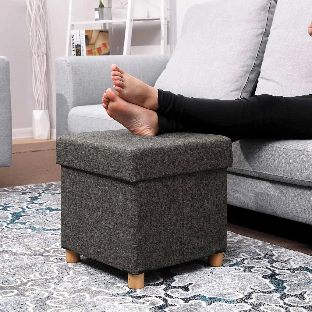 Pouf contenitore grigio scuro con gambe in legno