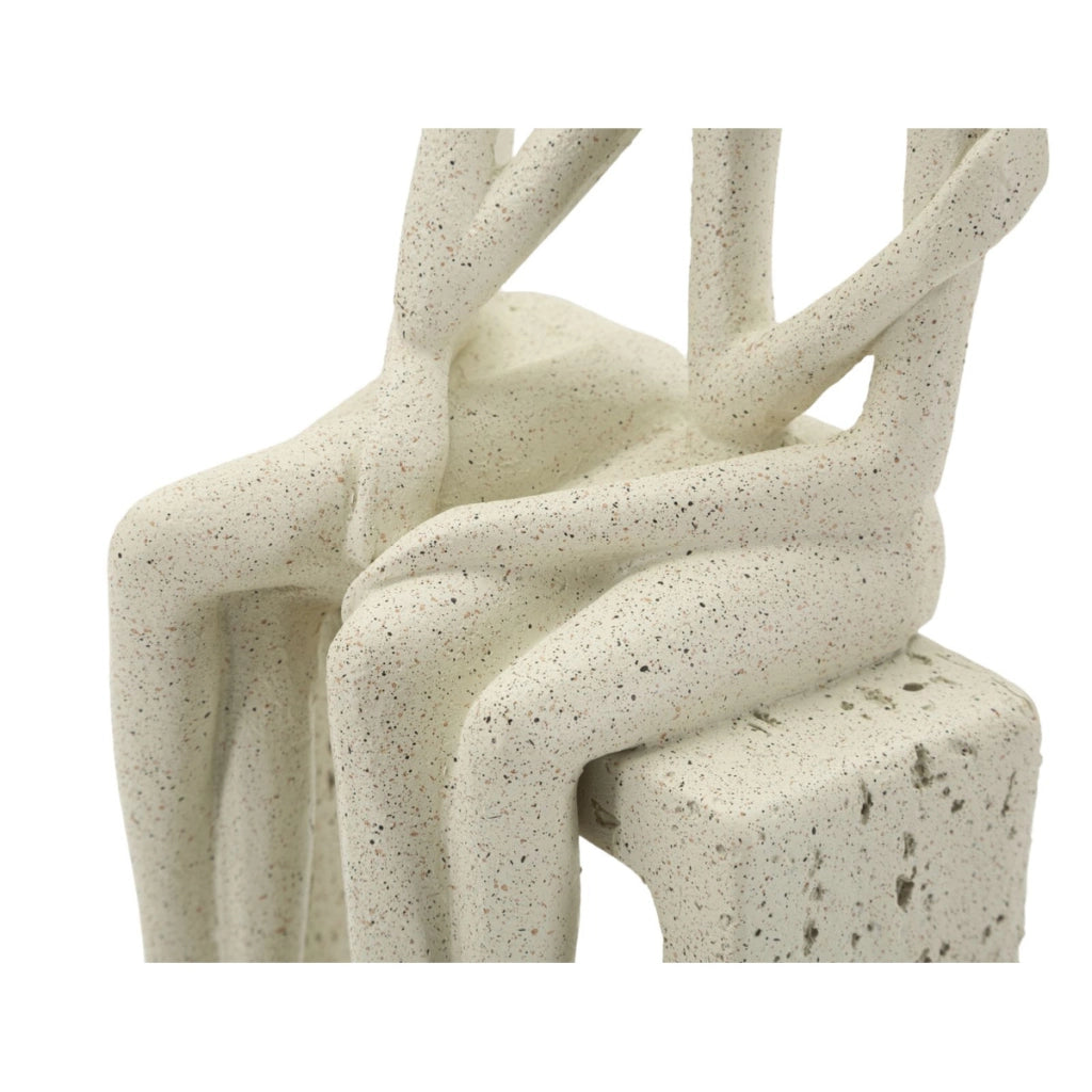 Statuetta coppia Stons in resina color crema