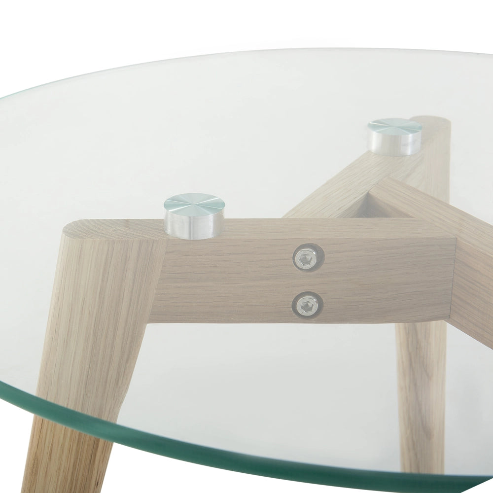 Set di 2 tavolini a nido tondi trasparenti con piano in vetro 3 gambe in legno chiaro minimalista scandinavo