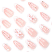 24 pezzi di unghie artificiali a forma di mandorla con decorazioni a 3D e fiocchi rosa
