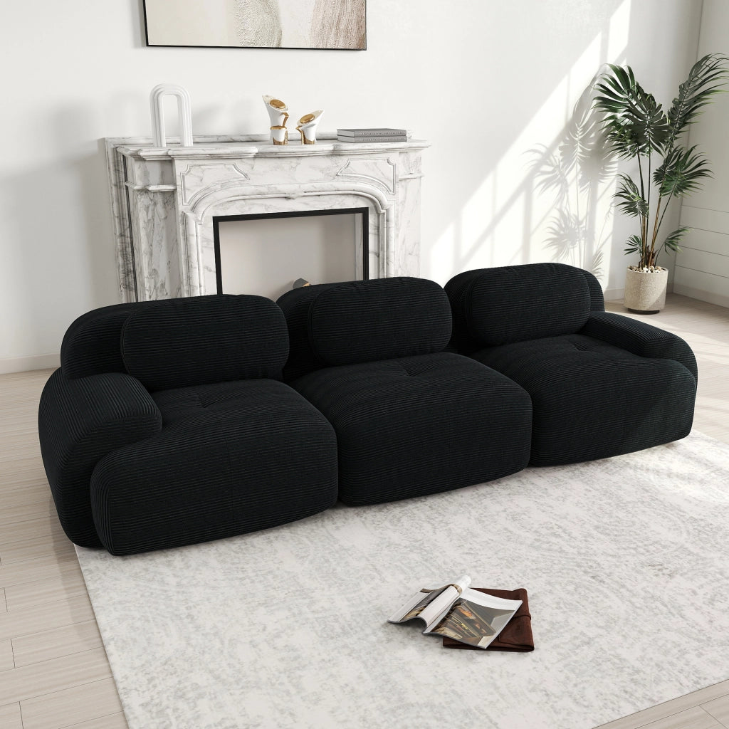 Divano angolare modulare in velluto a coste senza montaggio con braccioli ergonomici e base antiscivolo nero