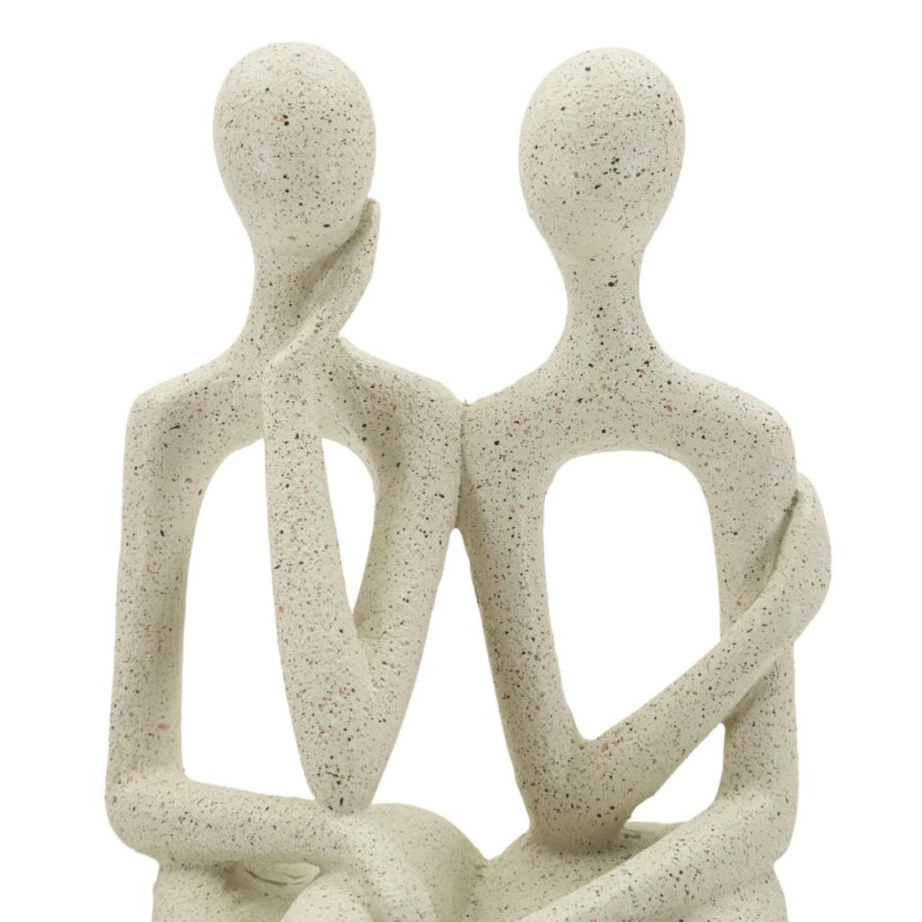 Statuetta coppia Stons in resina color crema