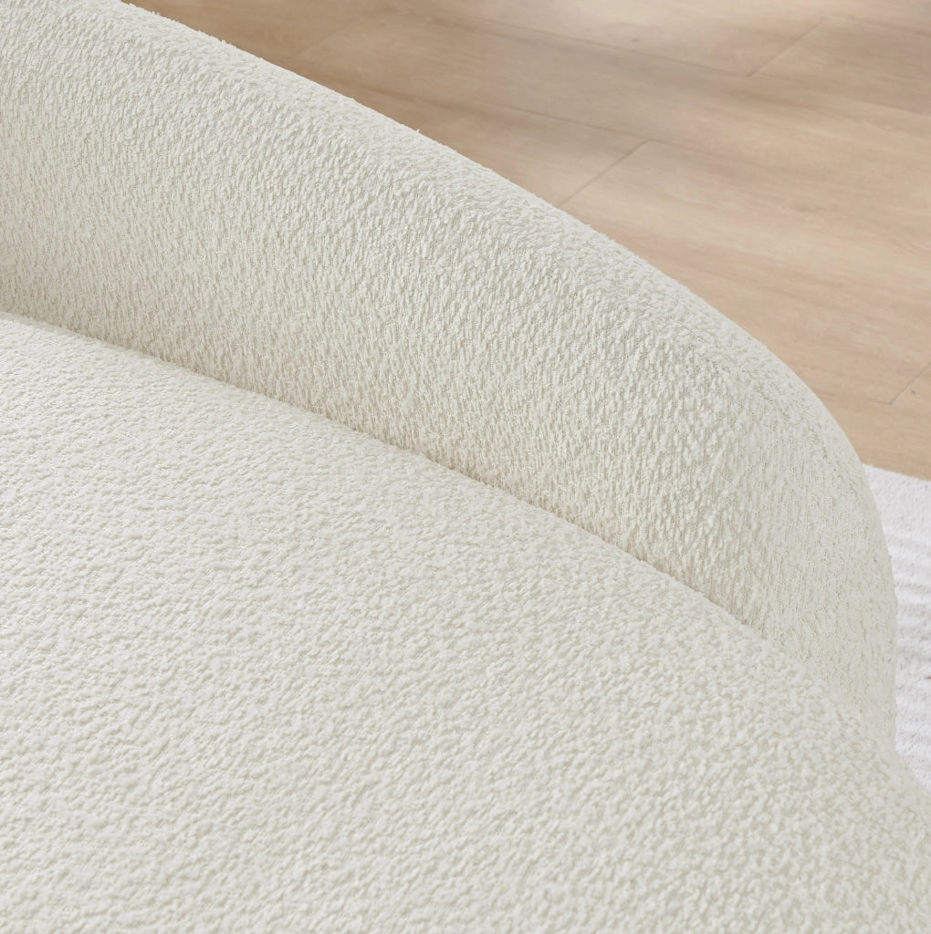 Sofa in tessuto teddy con design arrotondato; beige