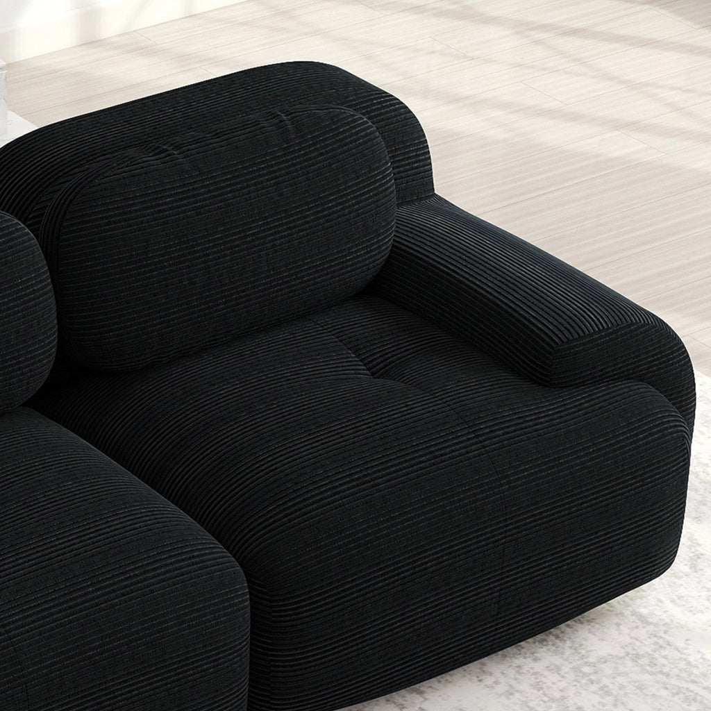 Divano angolare modulare in velluto a coste senza montaggio con braccioli ergonomici e base antiscivolo nero