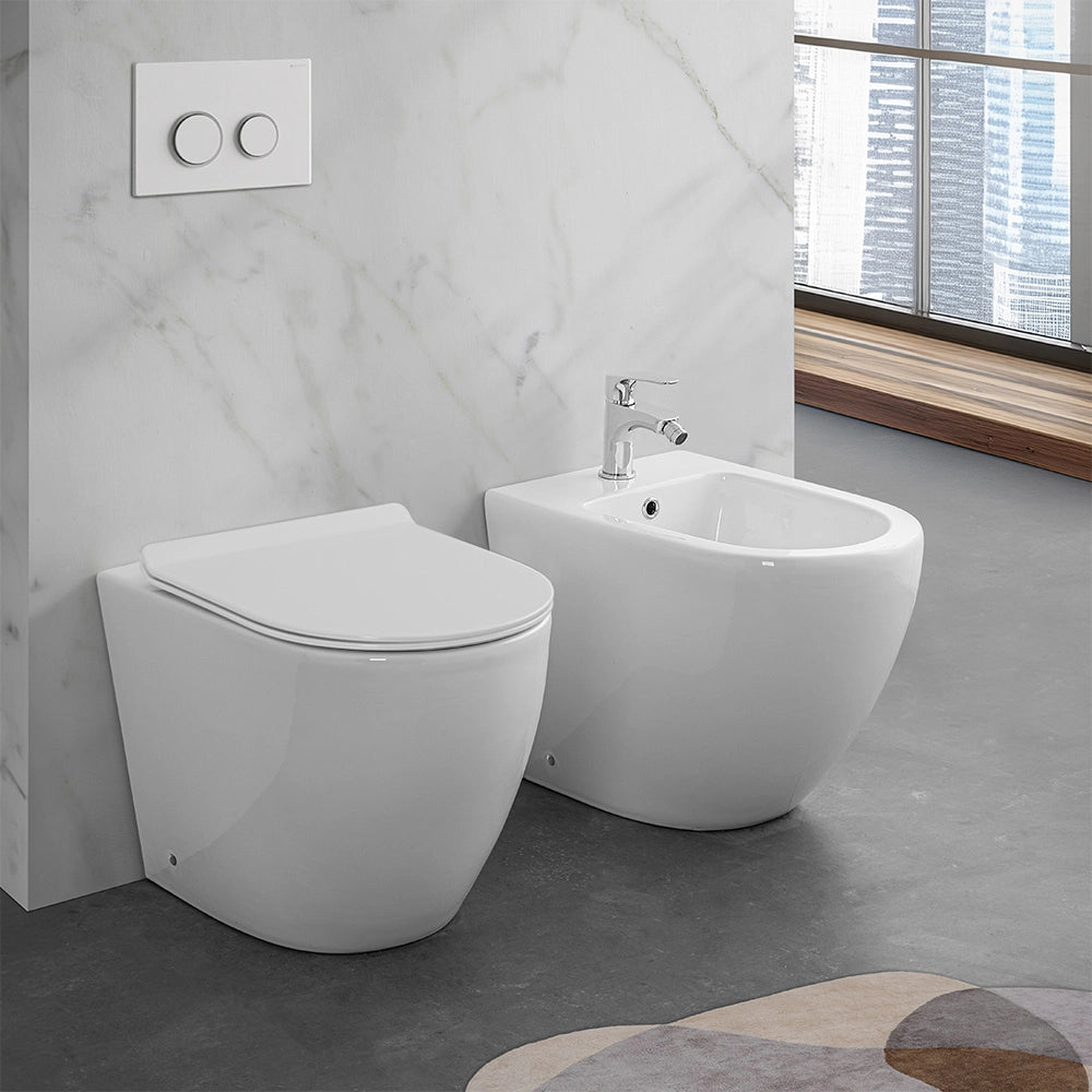 Wc e bidet filomuro per anziani con scarico traslato serie Comoda