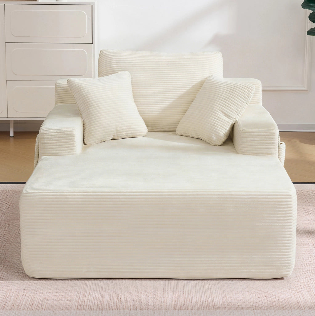 Sofa compatto in corduroy beige con tasche laterali e cuscini inclusi