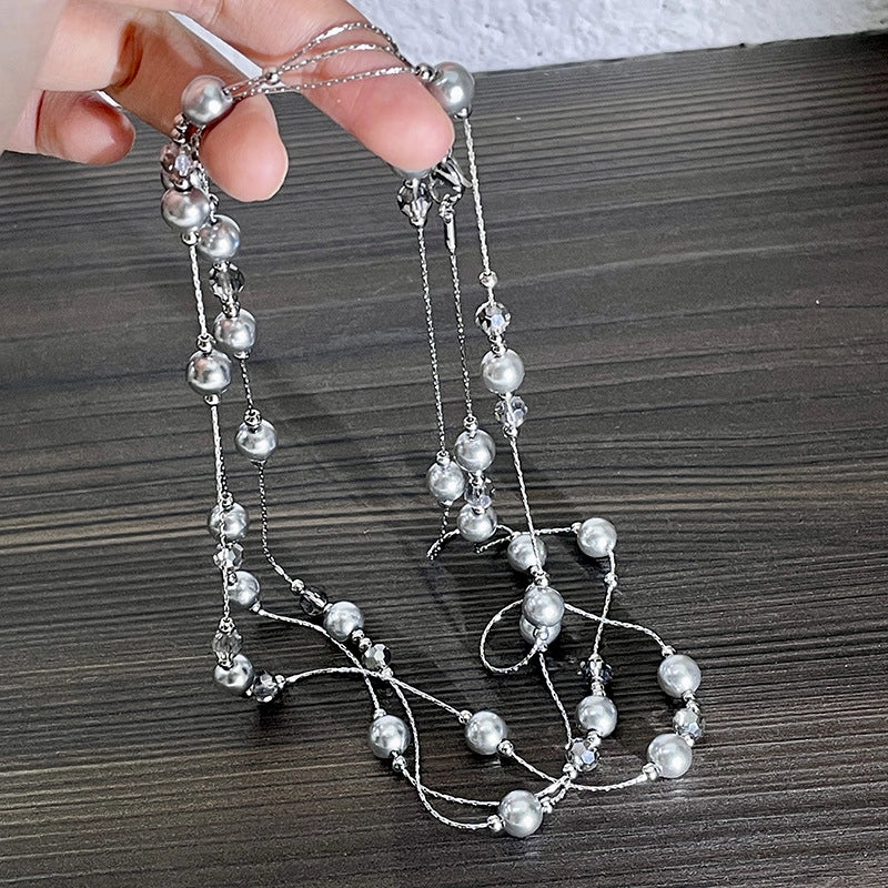 Collana lunga con stella di perle grigio argento