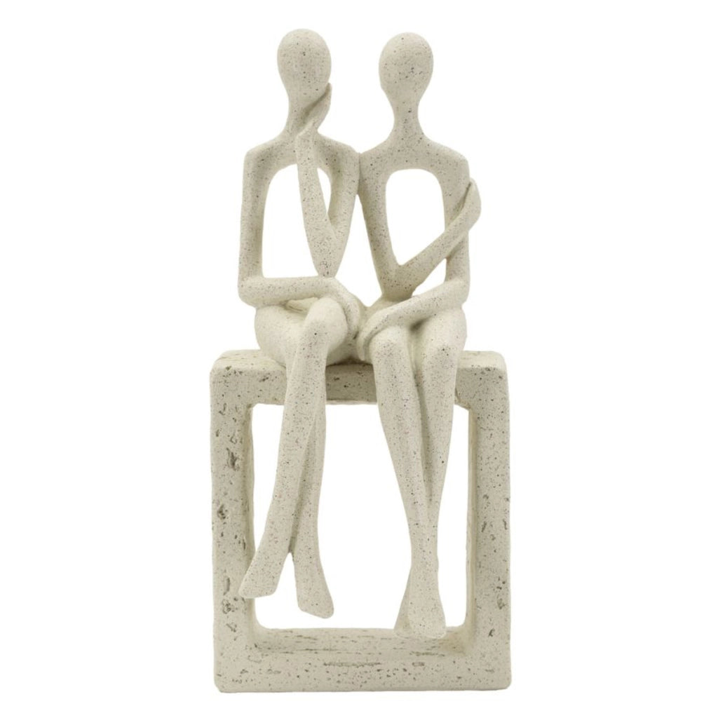 Statuetta coppia Stons in resina color crema