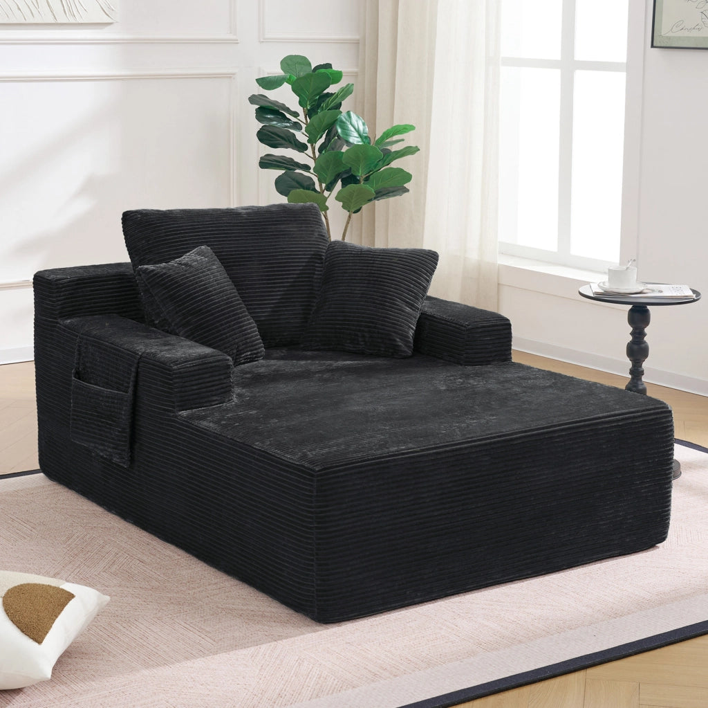 Divano compatto in corduroy nero con tasche laterali e cuscini; stile retr貌