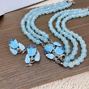 Set composto da collana e orecchini con cristalli blu: gioielli realizzati a mano con perline.
