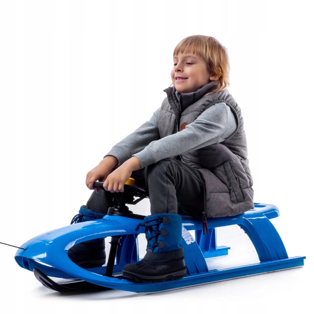 Slittino in plastica KADAX con volante per bambini, ideale per discese in montagna.