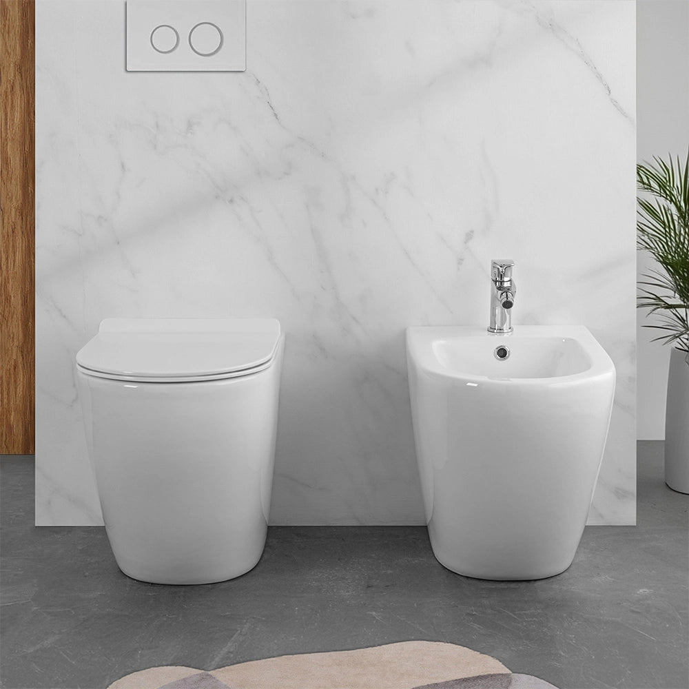 Wc e bidet filomuro per anziani con scarico traslato serie Comoda