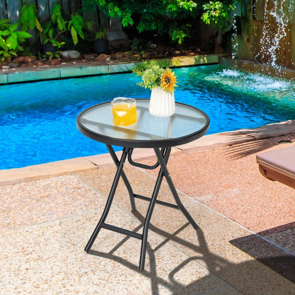 Tavolo rotondo da pranzo per patio con piano in vetro temperato, Tavolo con telaio antiruggine e struttura a X-Tavoli da esterno